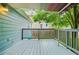 Open-air back deck with a canopy featuring shade and outdoor space at 877 Mclendon Dr, Scottdale, GA 30079