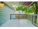 Open-air back deck with a canopy featuring shade and outdoor space at 877 Mclendon Dr, Scottdale, GA 30079