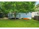 Inviting backyard featuring a lush lawn and a charming home exterior at 877 Mclendon Dr, Scottdale, GA 30079