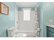 Aqua bathroom featuring a tub and shower combo and tiled walls at 877 Mclendon Dr, Scottdale, GA 30079