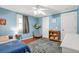 Cozy bedroom with stylish rug, chair, and accents at 877 Mclendon Dr, Scottdale, GA 30079