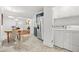 Convenient laundry area next to the kitchen with washer, dryer and additional storage cabinets at 877 Mclendon Dr, Scottdale, GA 30079
