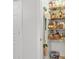 Well-stocked pantry with ample shelving for organized storage of food and household items at 877 Mclendon Dr, Scottdale, GA 30079
