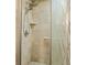 Tiled shower with rainfall shower head and frosted glass door at 877 Mclendon Dr, Scottdale, GA 30079