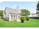 Lovely backyard showing the rear exterior with mature landscaping and double doors at 1460 Chamirey Sw Dr, Marietta, GA 30008