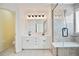 Luxurious bathroom with double sinks, modern lighting, and glass shower at 1460 Chamirey Sw Dr, Marietta, GA 30008