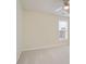 Bedroom with a ceiling fan, plush carpeting, and a bright window view at 1460 Chamirey Sw Dr, Marietta, GA 30008