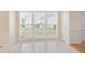Bright breakfast nook features tile flooring, multiple windows, and neutral walls at 1460 Chamirey Sw Dr, Marietta, GA 30008