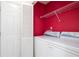 Laundry room with modern washer and dryer and storage shelves at 1460 Chamirey Sw Dr, Marietta, GA 30008