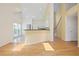Open-concept living room with view to kitchen, hardwood flooring, and natural light at 1460 Chamirey Sw Dr, Marietta, GA 30008