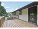 Back of the house featuring a wood deck, siding, and fenced yard at 2784 Oxford Dr, Decatur, GA 30034