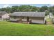 Exterior shot of the back of the house showing the wooden deck and spacious backyard at 2784 Oxford Dr, Decatur, GA 30034