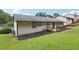 Lawn and wooden deck are features of this home's backyard at 2784 Oxford Dr, Decatur, GA 30034