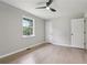 Bedroom featuring hardwood floors, a window, and a ceiling fan at 2784 Oxford Dr, Decatur, GA 30034