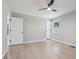 Neutral bedroom features hardwood floors, ceiling fan and two white doors at 2784 Oxford Dr, Decatur, GA 30034