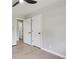 Neutral bedroom featuring two entry doors and hardwood flooring at 2784 Oxford Dr, Decatur, GA 30034