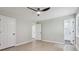 Spacious bedroom features hardwood floors, ceiling fan, and bathroom doorway at 2784 Oxford Dr, Decatur, GA 30034
