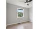 Bright bedroom featuring hardwood floors, large window, and a ceiling fan at 2784 Oxford Dr, Decatur, GA 30034