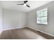 Bedroom with a ceiling fan, hardwood floors, and a window at 2784 Oxford Dr, Decatur, GA 30034