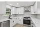 Updated kitchen with stainless steel appliances, quartz countertops, and white subway tile backsplash at 2784 Oxford Dr, Decatur, GA 30034