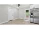 Dining area featuring stainless steel refrigerator and back yard access at 2784 Oxford Dr, Decatur, GA 30034