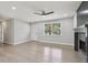 Spacious living room with hardwood floors, large window, and fireplace at 2784 Oxford Dr, Decatur, GA 30034