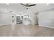 Open-concept floorplan with wood floors, updated kitchen, and modern ceiling fan at 2784 Oxford Dr, Decatur, GA 30034