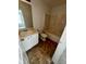 Full bathroom with a vanity, toilet, and tub/shower combination with a tile surround at 3609 Ginnis Rd, Atlanta, GA 30331
