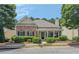 Charming one-story home with a well-maintained lawn and mature landscaping at 557 Pringle Dr, Suwanee, GA 30024