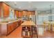 Spacious kitchen with center island, stainless appliances, and an adjoining dining area at 557 Pringle Dr, Suwanee, GA 30024