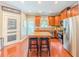 Bright kitchen featuring a center island with seating and stainless steel appliances at 557 Pringle Dr, Suwanee, GA 30024