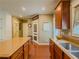 Another view of a well-equipped kitchen featuring a center island with seating and granite counters at 557 Pringle Dr, Suwanee, GA 30024