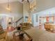 Spacious living room with soaring ceilings, a cozy seating area, and hardwood floors at 557 Pringle Dr, Suwanee, GA 30024