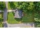 Aerial view of a home showcasing its spacious yard, mature trees, and neighborhood surroundings at 984 Ridgecrest Se Dr, Smyrna, GA 30080