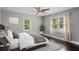 Comfortable bedroom with natural light from two windows and a ceiling fan at 984 Ridgecrest Se Dr, Smyrna, GA 30080