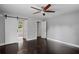 Main bedroom with sliding door to bathroom, laminate flooring, and neutral paint at 984 Ridgecrest Se Dr, Smyrna, GA 30080