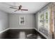 Empty bedroom showing 2 windows with curtains, and a ceiling fan at 984 Ridgecrest Se Dr, Smyrna, GA 30080