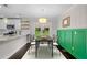 Charming dining area featuring stylish wainscoting, modern lighting, and seamless access to a well-equipped kitchen at 984 Ridgecrest Se Dr, Smyrna, GA 30080