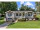 Charming front exterior with swing, landscaping and a combination brick and siding facade at 984 Ridgecrest Se Dr, Smyrna, GA 30080