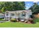 Charming front exterior with swing, landscaping and a combination brick and siding facade at 984 Ridgecrest Se Dr, Smyrna, GA 30080