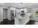 Stylish kitchen featuring white cabinets, granite countertops, stainless steel appliances, and a functional island at 984 Ridgecrest Se Dr, Smyrna, GA 30080