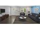 Inviting living room featuring hardwood floors, ample seating, modern decor, and lots of natural light at 984 Ridgecrest Se Dr, Smyrna, GA 30080