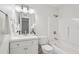 Bright bathroom with a modern vanity, white color scheme, and a shower over tub at 1166 Booth Sw Rd # 301, Marietta, GA 30008