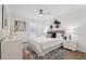 Bright bedroom featuring a neutral palette with light gray rug, white furniture and decorative pillows on the bed at 1166 Booth Sw Rd # 301, Marietta, GA 30008