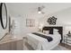 Bedroom featuring neutral decor, ceiling fan, hardwood floors, and decorative touches at 1166 Booth Sw Rd # 301, Marietta, GA 30008