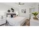Bright bedroom featuring a ceiling fan, stylish decor, and a comfortable bed with plush pillows at 1166 Booth Sw Rd # 301, Marietta, GA 30008