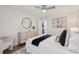 Bedroom featuring neutral decor, ceiling fan, hardwood floors, and natural light at 1166 Booth Sw Rd # 301, Marietta, GA 30008