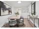 Dining room with modern light fixture, stylish decor, dining table with seating, and hardwood floors at 1166 Booth Sw Rd # 301, Marietta, GA 30008