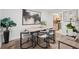 Modern dining room featuring a dining table with stylish chairs, elegant decor, and hardwood floors at 1166 Booth Sw Rd # 301, Marietta, GA 30008