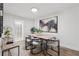 Bright dining room features wood floors, modern light fixture, and table set for six under contemporary art at 1166 Booth Sw Rd # 301, Marietta, GA 30008